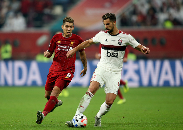 Pablo Mari of CR Flamengo competes for the ball with Roberto Firmino of Liverpool during the FIFA Club World Cup Final Match between Liverpool FC and CR Flamengo at Khalifa International Stadium on December 21, 2019 in Doha, Qatar.